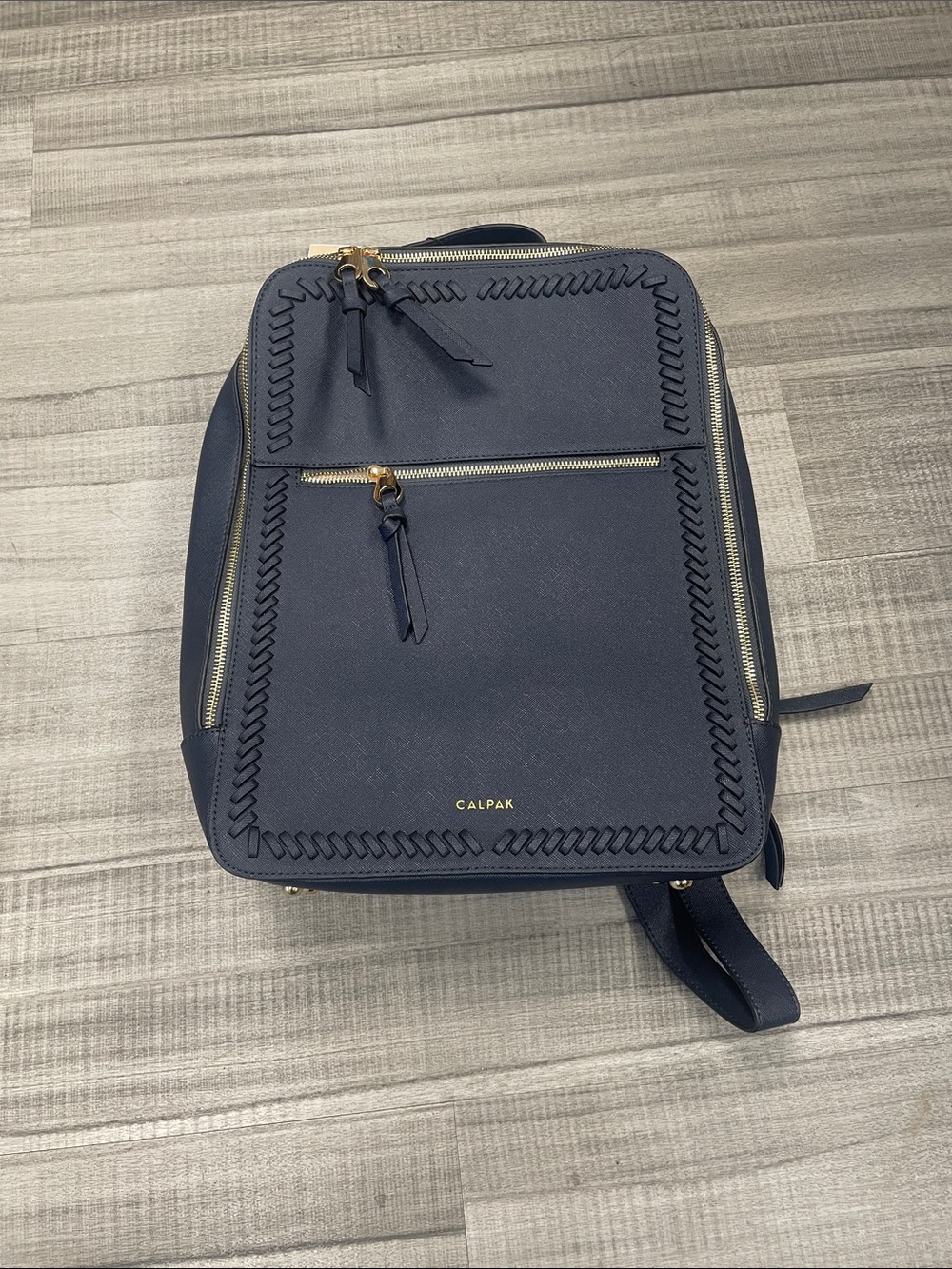 Calpak Navy Backpack with Gold Hardware and Woven Trim